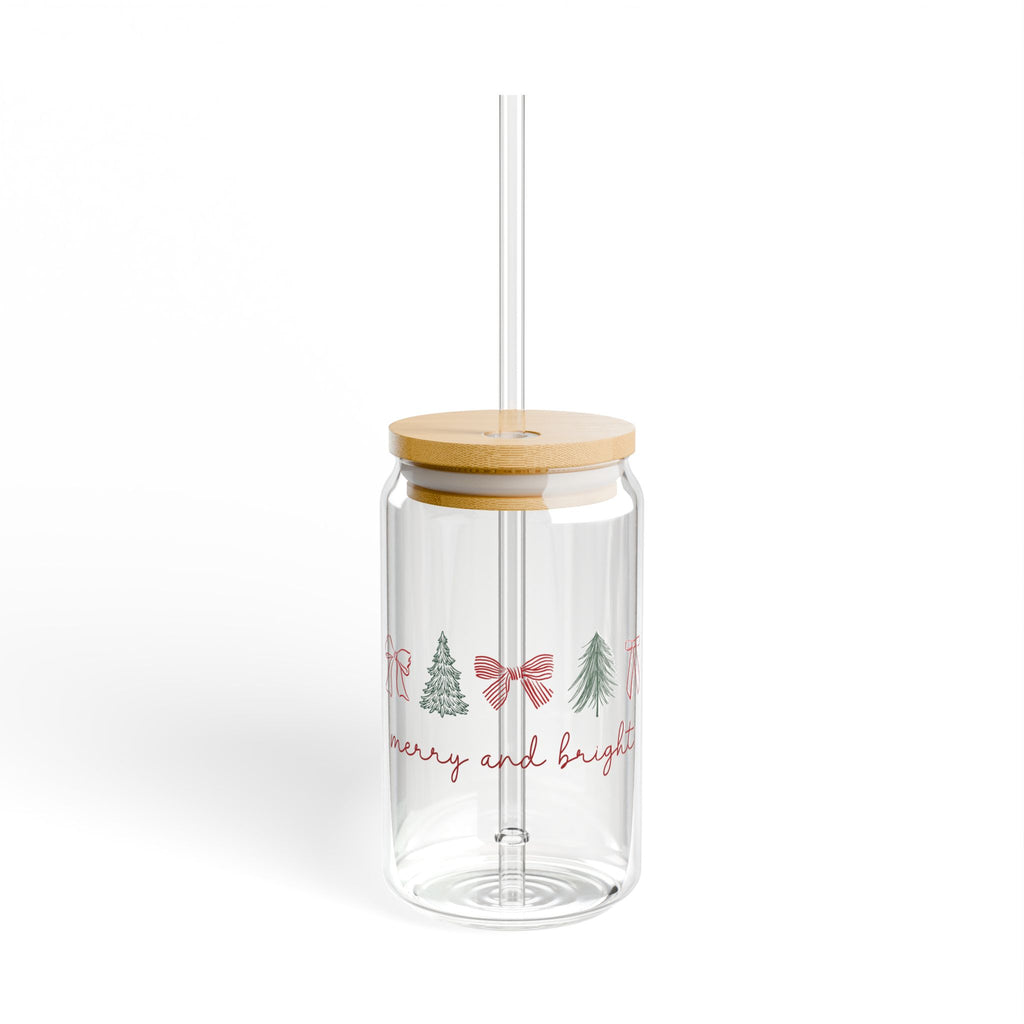 Clear 16oz glass sipper with Merry and Bright lettering and small holiday bows on the front.