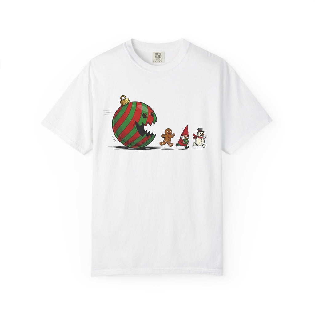 Garment-dyed unisex t-shirt showing a giant striped ornament chasing a gingerbread person, a tiny gnome, and a snowman across the chest, playful holiday mischief graphic, relaxed fit.