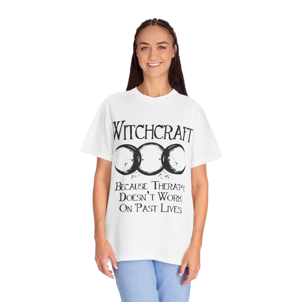 Person wearing a white t-shirt with 'Witchcraft' and moon symbol design.
