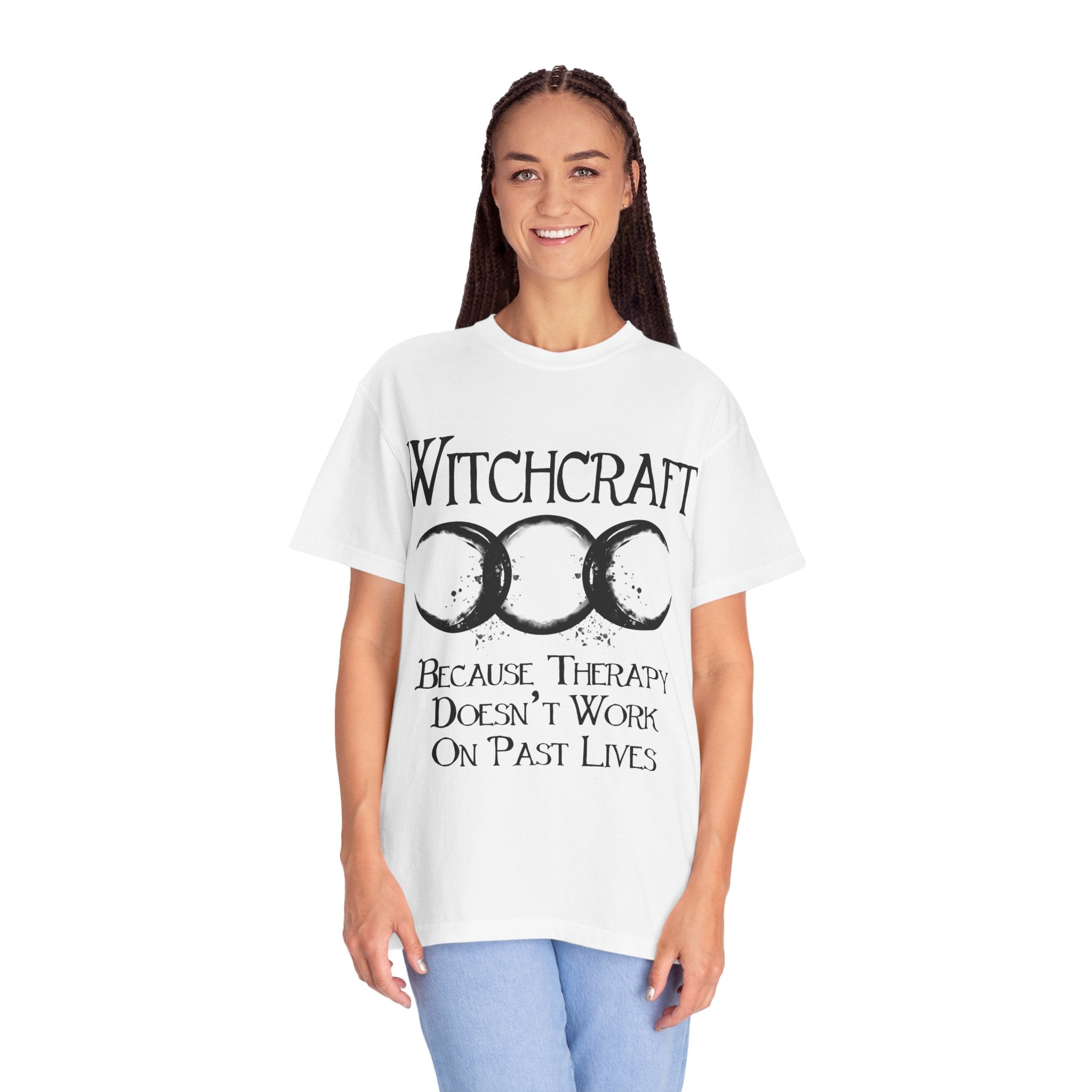 Person wearing a white t-shirt with 'Witchcraft' and moon symbol design.