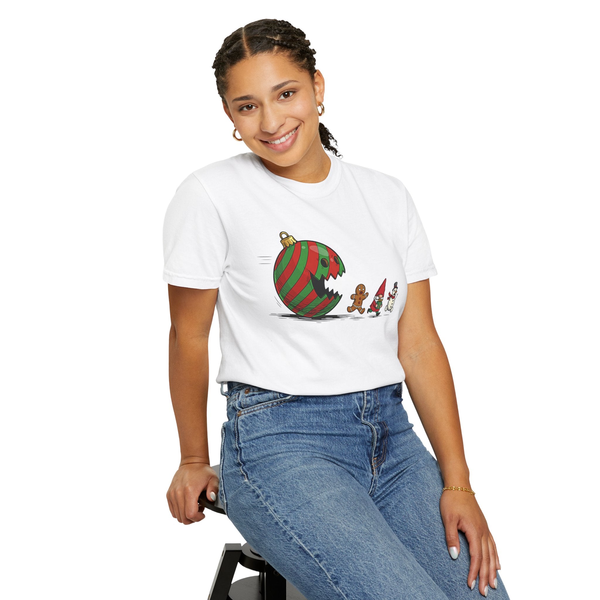 Model wearing the t-shirt styled with cozy winter layers, showing the ornament chasing the gingerbread, gnome, and snowman, perfect for casual holiday outings or festive indoor fun.